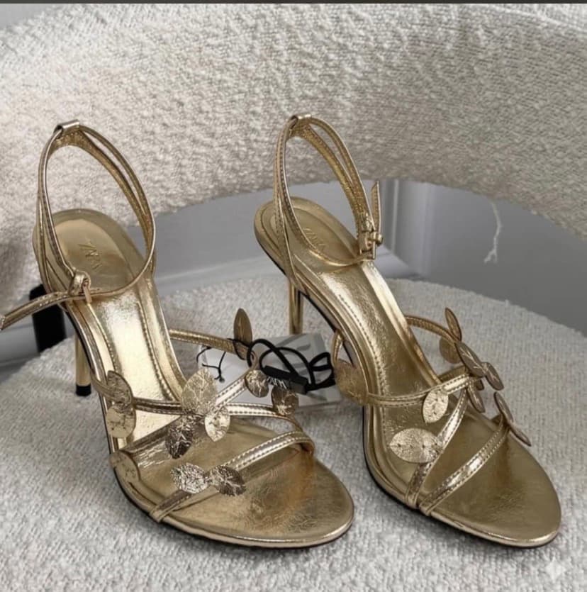 gold-colored high-heeled sandals by Zara