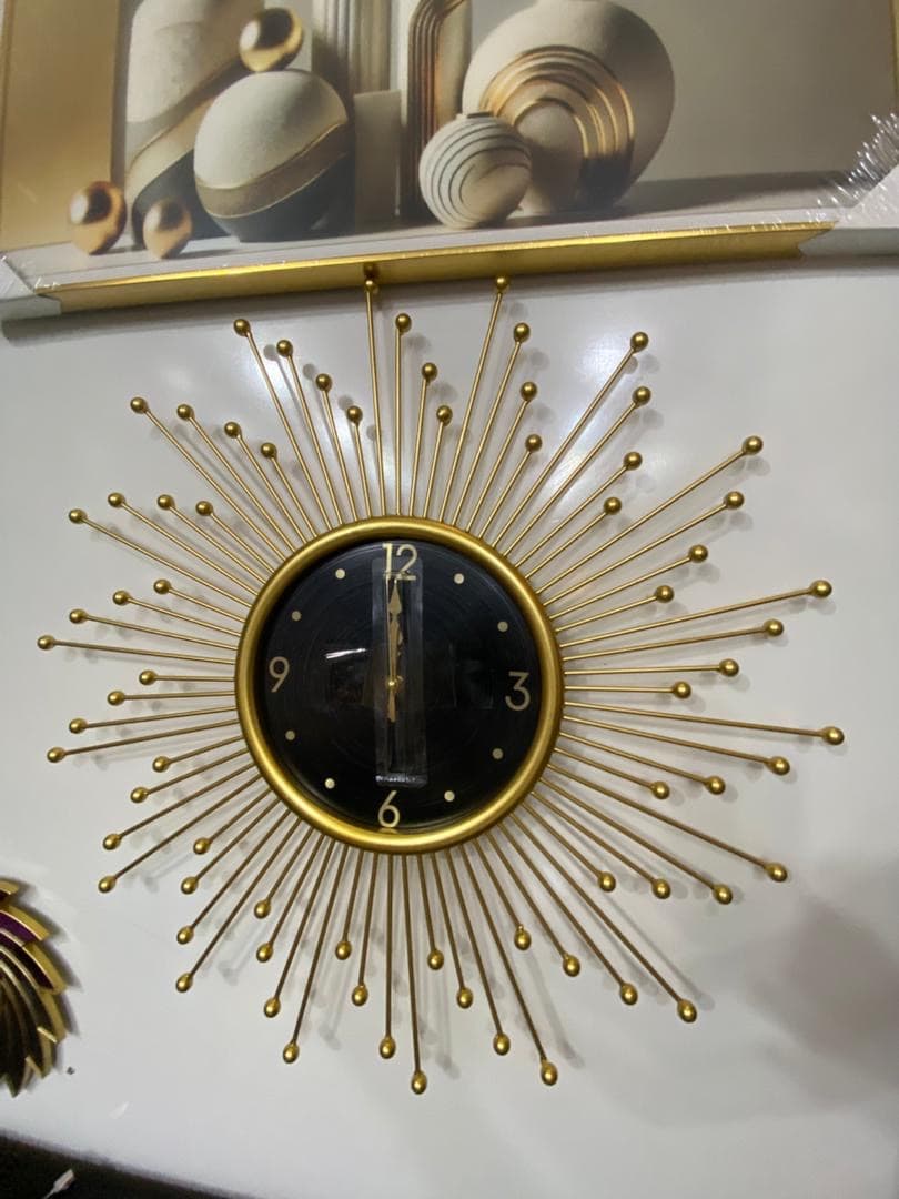 gold sunburst wall clock